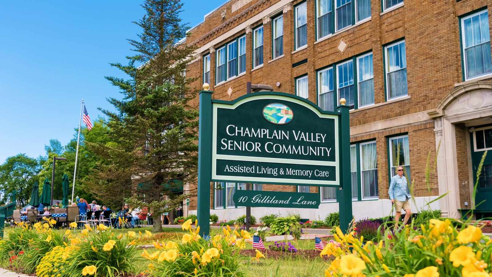 Sign and landscape with CVSC building in the background. 